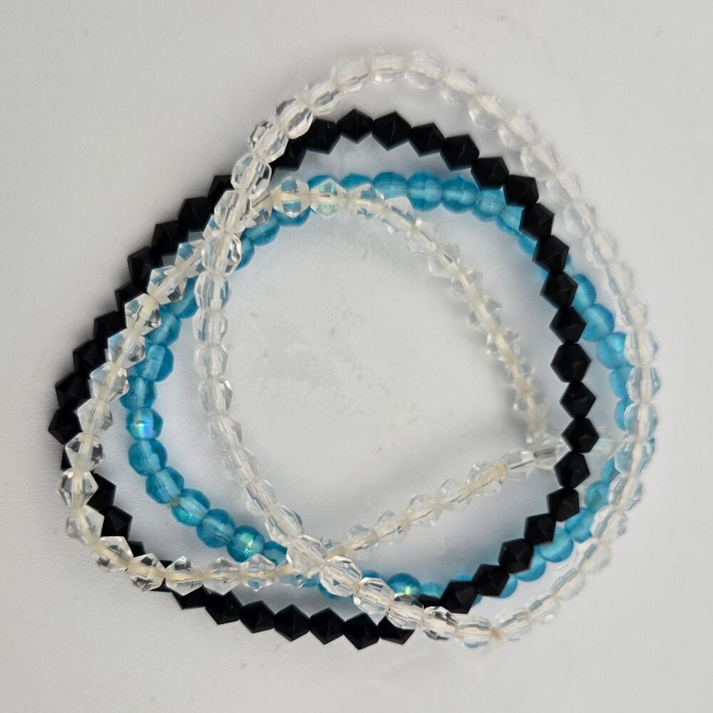 4 Strands of Small Bead Stretchy Bracelets One Blue One Black Two Clear